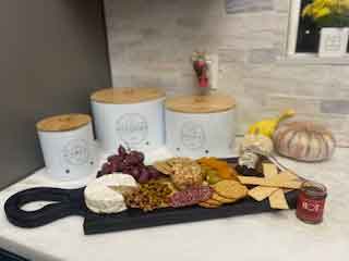 Wood and Black Epoxy Charcuterie Board Decorated